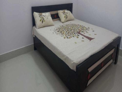 OYO Hotel Rohit Sagar客房内的一张或多张床位