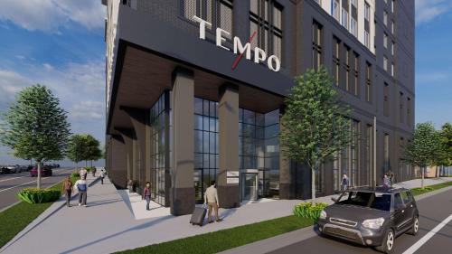 罗利Tempo By Hilton Raleigh Downtown的建筑物入口 ⁇ 染的 ⁇ 染