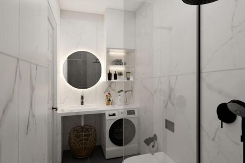 雅典Vouliagmeni Garden Suite by Astir beach的白色的浴室设有水槽和镜子