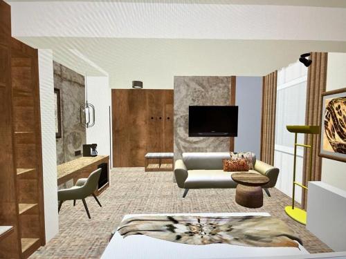 蒂米什瓦拉Hotel Serenity的带沙发和电视的客厅