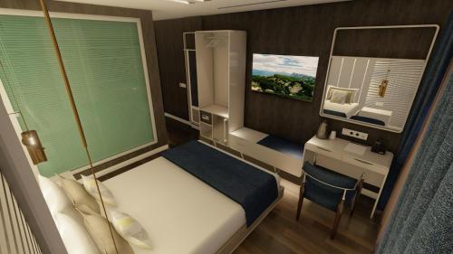 İmrahorLotus Airport Hotel的小房间设有一张床和一张书桌