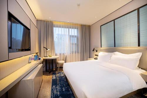 Starway Hotel Zhengzhou 2Nd Qquare Renmin Road客房内的一张或多张床位