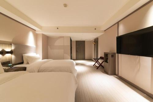 Hanting Hotel Xi'an Park South Road客房内的一张或多张床位