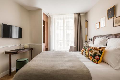 Hôtel Chamar客房内的一张或多张床位