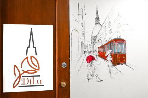 格鲁利亚斯科[La Casa DiLù] Moderno Trilocale e Ampio Terrazzo的红电车的街道画