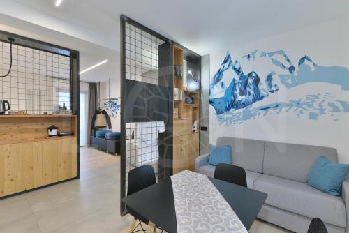 奥斯塔Le Lion Apartments - Bike & Ski的客厅配有沙发和桌子