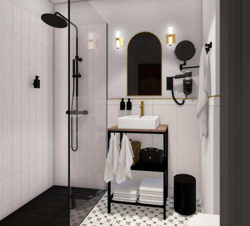 比亚韦斯托克Apartamenty Branicka的带淋浴、水槽和镜子的浴室