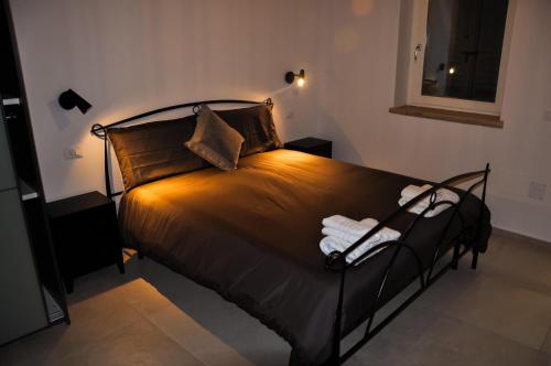 Bramante Suites Urbino客房内的一张或多张床位