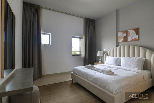 迪拜WelHome - Prime 1BR Apartment at Oia Residence的一间卧室,卧室内配有一张大床