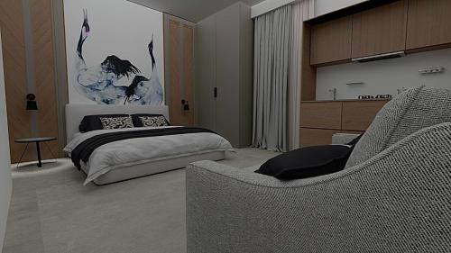 斯基亚索斯镇SKIATHOS MODERNO的一间卧室配有一张床和一张沙发