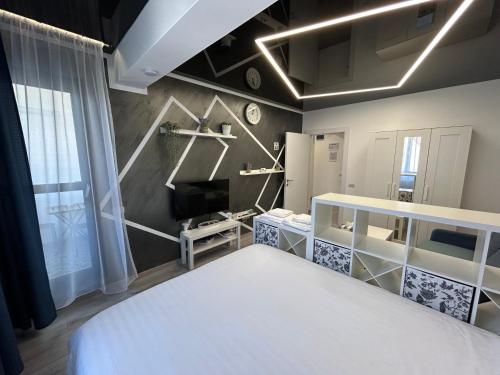 Popeşti-LeordeniPerla Home - Studio 9的卧室配有白色的床