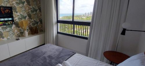 萨尔瓦多COSTE0104 - Premium Stella Maris的一间卧室设有海景窗户