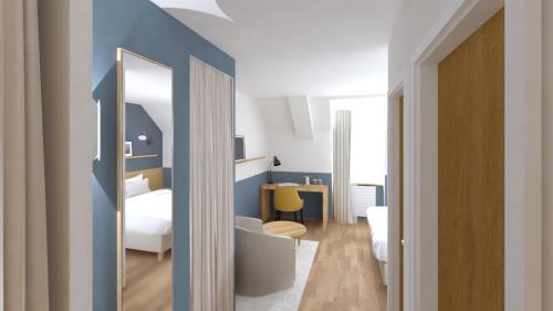 卡朗泰克Logis Hôtel de Carantec的客房设有带一张床和镜子的卧室
