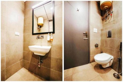 新德里Hotel Roayal International By Le Cashew Rooms的一间带卫生间、水槽和镜子的浴室