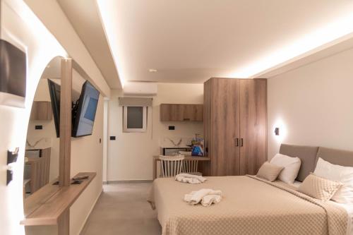 罗希姆诺米西里亚公寓的酒店客房设有两张床和电视。