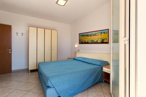 Residence il Girasole 1客房内的一张或多张床位