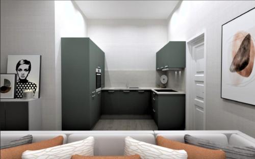 法夫Barnet House Serviced Apartments的厨房配有黑色橱柜和白色沙发