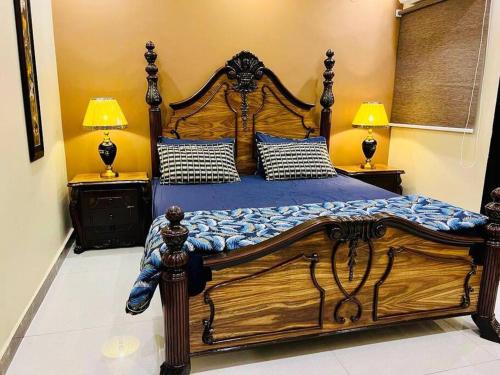 Bahria Town Lahore - NEXT INN Two Bedroom condo with free parking 203