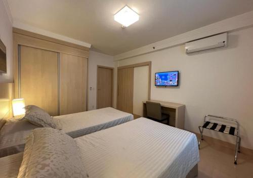 Apart-hotel Ribeirânia客房内的一张或多张床位