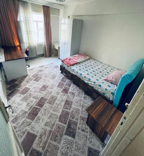 迪亚巴克尔Diyarbakır bölgesinde konaklama的卧室配有一张床