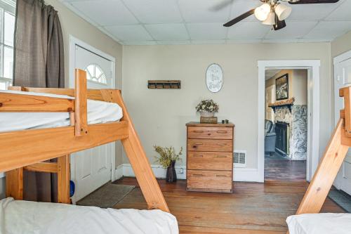 Spacious West Virginia Home Ride to ATV Trails!的一间卧室设有两张双层床和吊扇