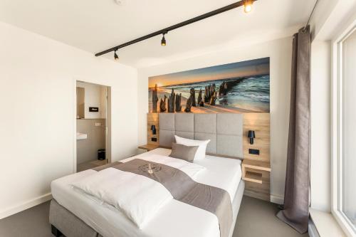 达默Quartier’76的一间卧室设有两张床,墙上挂着一幅画