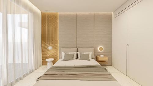 GlífaSANTA MARINA RESORT的卧室配有一张带白色墙壁的大床
