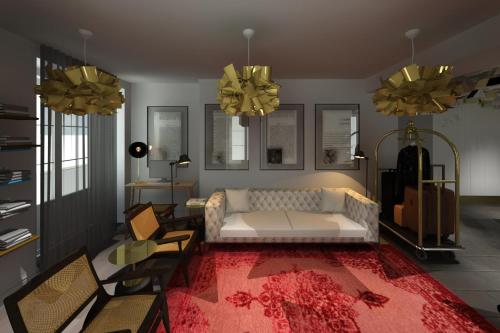 英雄港L Boutique Hotel的客厅配有白色沙发和红色地毯。