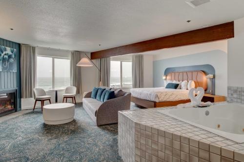 亚查茨Adobe Resort的酒店客房配有一张床和浴缸。