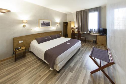 帕多瓦郁金香酒店客房内的一张或多张床位
