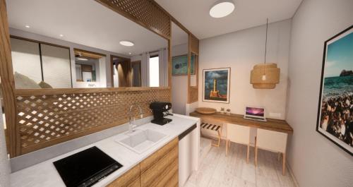 雅拉尼奥玛兹公寓式酒店的厨房配有水槽和台面