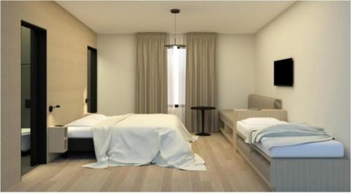 海拉海斯埃玛尔酒店的一间医院间,配有两张床和一张桌子