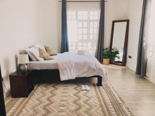 Serenity Homes Arusha客房内的一张或多张床位
