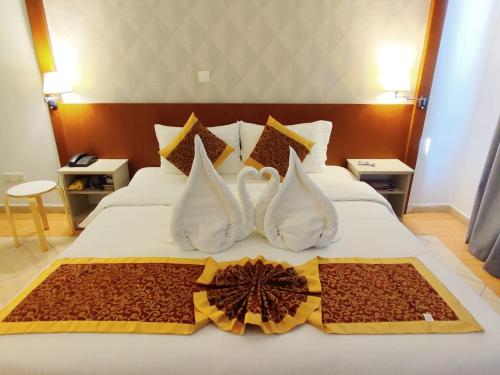 阿卡维斯塔套房酒店客房内的一张或多张床位