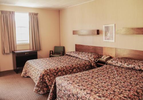 轩汽车旅馆客房内的一张或多张床位
