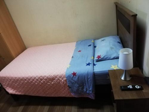 Hostal Nauu客房内的一张或多张床位