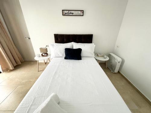 Apartamento Ideal Para Parejas Cerca Al Aeropuerto客房内的一张或多张床位