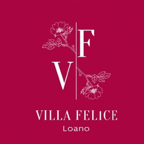 洛阿诺VILLA FELICE的红色背景的花与一封信