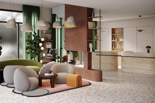 日内瓦Residence Inn by Marriott Geneva City Nations的大堂配有沙发、椅子和桌子