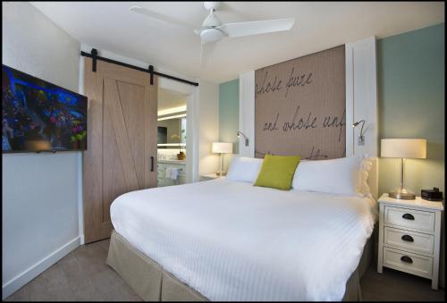 洛伊斯唐塞萨尔海滨别墅套房酒店 客房内的一张或多张床位