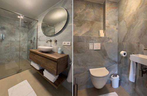贝克斯拜克酒店的一间带水槽、卫生间和镜子的浴室