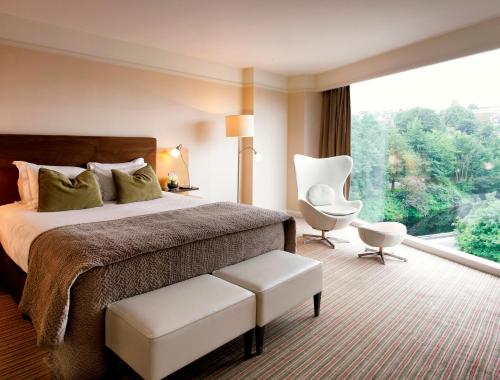 瑞维尔李酒店 - 多伊尔酒店集团客房内的一张或多张床位