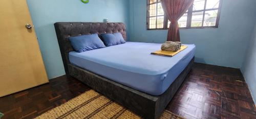 Tatai Kumang Homestay客房内的一张或多张床位