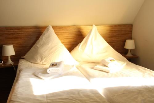 菲尔恩豪弗迪特池尔本酒店客房内的一张或多张床位