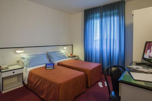 昆德利佛利欧酒店客房内的一张或多张床位