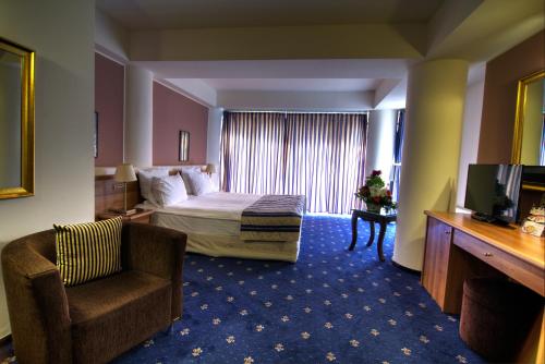 杜姆布瓦维酒店客房内的一张或多张床位