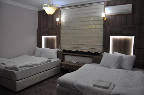 Mevlana Palace客房内的一张或多张床位