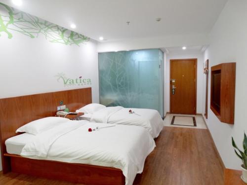 青皮树上海市嘉定区安亭地铁站墨玉路酒店客房内的一张或多张床位