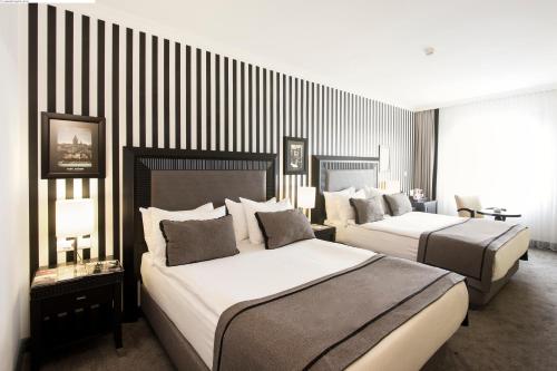 塔克西姆阿旺嘉德酒店客房内的一张或多张床位
