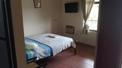 Hostal SAN JOSE PLAZA - TAYRONA 1客房内的一张或多张床位